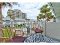 Inviting balcony with outdoor seating and views of the tropical resort at 4225 S Atlantic Ave # 2150, New Smyrna Beach, FL 32169