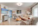 Bright living room features stylish furnishings and a large flat-screen TV at 4225 S Atlantic Ave # 2150, New Smyrna Beach, FL 32169