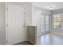 Bright entryway with neutral walls, ceramic tile flooring, and access to adjacent rooms at 4583 Barnacle Dr, Port Orange, FL 32127
