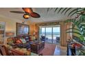 Comfortable living room with ocean views and balcony access at Towers Seven at 4651 S Atlantic Ave # 604, Ponce Inlet, FL 32127