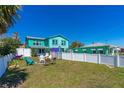 Spacious backyard with fire pit and outdoor seating, perfect for entertaining at 519 Mobile Ave, Daytona Beach, FL 32118