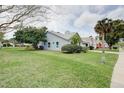 Well-maintained home with tidy landscaping, complemented by mature trees and a spacious lawn at 731 Pine Shores Cir, New Smyrna Beach, FL 32168