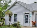 Close up of the home's front entrance showcasing the white brickwork and decorative wreath on the front door at 731 Pine Shores Cir, New Smyrna Beach, FL 32168
