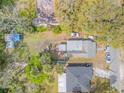 Aerial view of a property showcasing the roof, backyard, and surrounding greenery at 812 Marion St, Daytona Beach, FL 32114