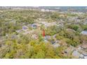 An aerial view showcases the property's location surrounded by lush greenery with distant city views at 812 Marion St, Daytona Beach, FL 32114
