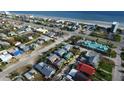 An aerial view showcases this charming beach community close to the ocean and local amenities at 835 E 24Th Ave # 111, New Smyrna Beach, FL 32169