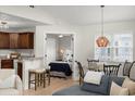 Open-concept living space with a kitchen, dining area, and views into the bedroom at 898 Baybreeze Way # 880, New Smyrna Beach, FL 32169