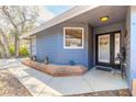 Charming front porch area with brick detail and welcoming decor at 6205 Klondike Dr, Port Orange, FL 32127