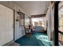 Relaxing screened porch with seating area, perfect for enjoying a quiet morning or evening at 68 Crooked Pine Rd, Port Orange, FL 32128