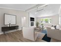 Bright living room featuring a white-brick fireplace and sleek, modern furnishings at 1227 Wayne Ave, New Smyrna Beach, FL 32168