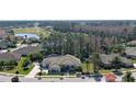An aerial view of the beautiful neighborhood and home in a lush golf community at 2904 Palma Ln, New Smyrna Beach, FL 32168