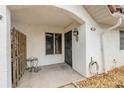 A cozy tiled front porch featuring a small table, privacy fence and stylish security door at 3522 Forest Branch Dr # B, Port Orange, FL 32129
