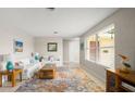 Inviting living room featuring bright walls, large windows, and stylish furnishings for comfortable living at 121 Ellicott Dr, Ormond Beach, FL 32176