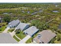 Scenic aerial view of homes in a peaceful neighborhood next to a wooded area at 1363 Wayne Ave, New Smyrna Beach, FL 32168
