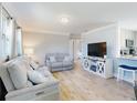 Bright and airy living room with comfortable seating and a modern entertainment center at 16 Hillside Dr, New Smyrna Beach, FL 32169
