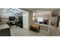 Inviting kitchen with modern appliances, stylish cabinets, and a cozy breakfast area next to the living room at 171 Fox Glen Ct, Ormond Beach, FL 32174