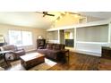 Comfortable living room with wood floors, vaulted ceiling, and neutral color palette at 171 Fox Glen Ct, Ormond Beach, FL 32174