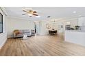 Bright and spacious living room with wood floors, neutral walls, and modern furniture at 1855 Pine Tree Dr, Edgewater, FL 32141