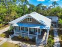 Gorgeous aerial view of home, landscaping, and outdoor living areas at 2656 Old Smyrna Trl, New Smyrna Beach, FL 32168