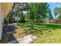 Expansive backyard with mature trees, providing ample shade and a serene atmosphere at 3016 Mango Tree Dr, Edgewater, FL 32141