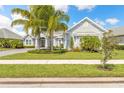 Inviting single-Gathering home with manicured lawn and lush landscaping at 3219 Modena Way, New Smyrna Beach, FL 32168