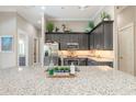 Bright kitchen showcases granite counters, stainless appliances, and decorative cabinetry at 3219 Modena Way, New Smyrna Beach, FL 32168