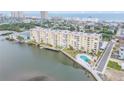 Aerial view of waterfront condo building with outdoor pool and beautiful dock at 3606 S Peninsula Dr # 509, Port Orange, FL 32127