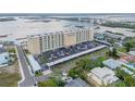 Aerial view showing Admiralty Club condo complex near the water, surrounding neighborhood, and covered parking at 3606 S Peninsula Dr # 509, Port Orange, FL 32127