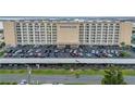 Exterior of the Admiralty Club condo building showcasing balconies and convenient covered parking at 3606 S Peninsula Dr # 509, Port Orange, FL 32127