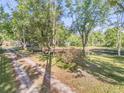 Scenic view of a charming pond surrounded by lush trees at 416 Western Rd, New Smyrna Beach, FL 32168