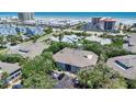 Aerial view of the condo building showing lush trees, landscaping, and access to the beach at 4307 Sea Mist Dr # 135, New Smyrna Beach, FL 32169