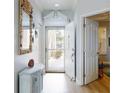 Bright entryway featuring a seashell mirror and ample natural light at 438 Bouchelle Dr # 104, New Smyrna Beach, FL 32169