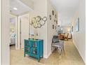 Inviting hallway with stylish decor leading to a bedroom and dining area at 5300 S Atlantic Ave # 14-202, New Smyrna Beach, FL 32169