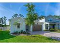 Lovely single-story home with a two-car garage and fresh landscaping at 5607 Estero Loop, Port Orange, FL 32128