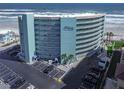 The exterior of this beautiful condo building features many floors, parking, and beach access at 705 N Atlantic Ave # 4030, New Smyrna Beach, FL 32169