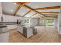 Spacious kitchen with granite island, stainless appliances, and access to the backyard at 1100 Loch Linnhe Ct, New Smyrna Beach, FL 32168