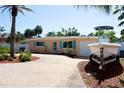 Charming single-story home boasting a boat on a trailer, well-maintained landscaping, and a spacious driveway at 3732 Cardinal Blvd, Port Orange, FL 32127
