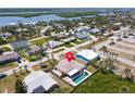 Aerial view of a coastal home with a private pool showcasing its location with beautiful landscaping at 4219 Oriole Ave, Port Orange, FL 32127