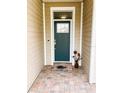 Inviting front door with decorative glass and brick walkway, enhancing curb appeal at 436 Eldora Dr, Oak Hill, FL 32759
