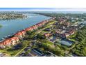 An aerial view featuring waterfront condo living with pools, tennis courts, and boat access at 445 Bouchelle Dr # 301, New Smyrna Beach, FL 32169
