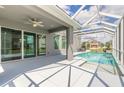A refreshing screened-in pool with a covered patio is ideal for relaxation at 6808 Forkmead Ln, Port Orange, FL 32128
