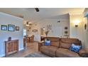 Open-concept living room flows into dining area, featuring comfortable seating and natural light at 1119 Wild Oak Ter, Deland, FL 32720