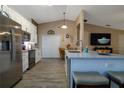 Bright kitchen showcasing a central island, stainless steel appliances, and modern finishes at 2204 Kumquat Dr, Edgewater, FL 32141