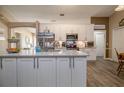Well-equipped kitchen featuring stainless steel appliances, modern cabinets, and a spacious island at 2204 Kumquat Dr, Edgewater, FL 32141