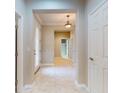 Bright entryway featuring tile floors, a decorative front door, and neutral wall colors at 3455 Pegaso Ave, New Smyrna Beach, FL 32168