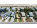 Aerial view of beach homes showcasing beautiful architectural designs and a serene coastal atmosphere at 6260 S Atlantic Ave, New Smyrna Beach, FL 32169