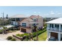 Charming two-story home with an attached garage, balconies, and manicured landscaping in a desirable neighborhood at 6260 S Atlantic Ave, New Smyrna Beach, FL 32169