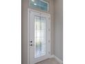 Elegant front door with decorative glass detailing welcomes you home at 6277 W Fallsgrove Ln, Port Orange, FL 32128