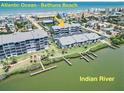 Exterior view of condos nestled between the ocean and Indian River at Bethune Beach, offering coastal living at 845 Ladyfish Ave # B204, New Smyrna Beach, FL 32169