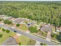 This aerial view showcases the home's proximity to green spaces within a serene neighborhood at 115 Los Arbor Dr, Deland, FL 32724